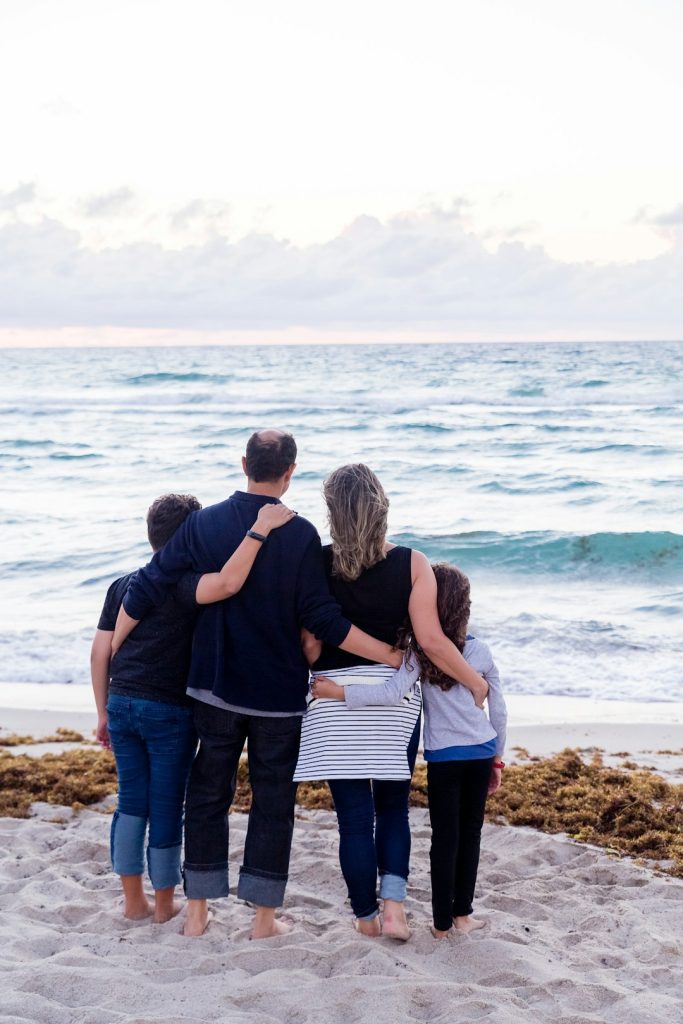 a-family-of-four-on-a-beach-6uywk8mdcwo